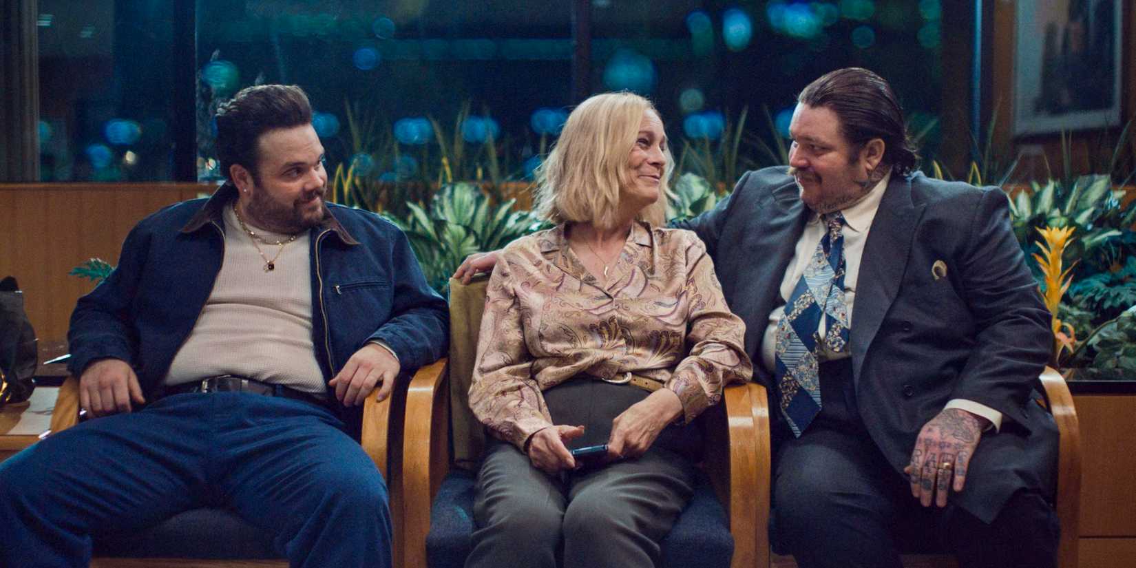 Fak (Matty Matheson) and Theodore (Ricky Staffieri) congratulating Donna (Jamie Lee Curtis) on the birth of her granddaughter in The Bear Season 3 Episode 8