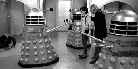 The First Doctor and Susan interacting with the Daleks in Doctor Who.