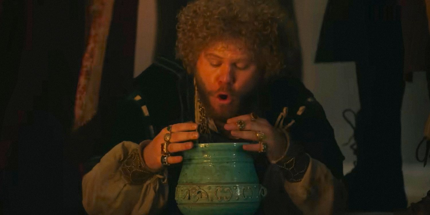 Tindaro (Douggie McMeekin) on the verge of throwing up in a vase in The Decameron season 1