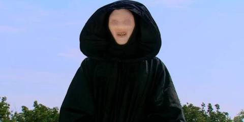 The Trickster floating in the air outside Sarah Jane's house on Bannerman Road in The Sarah Jane Adventures.