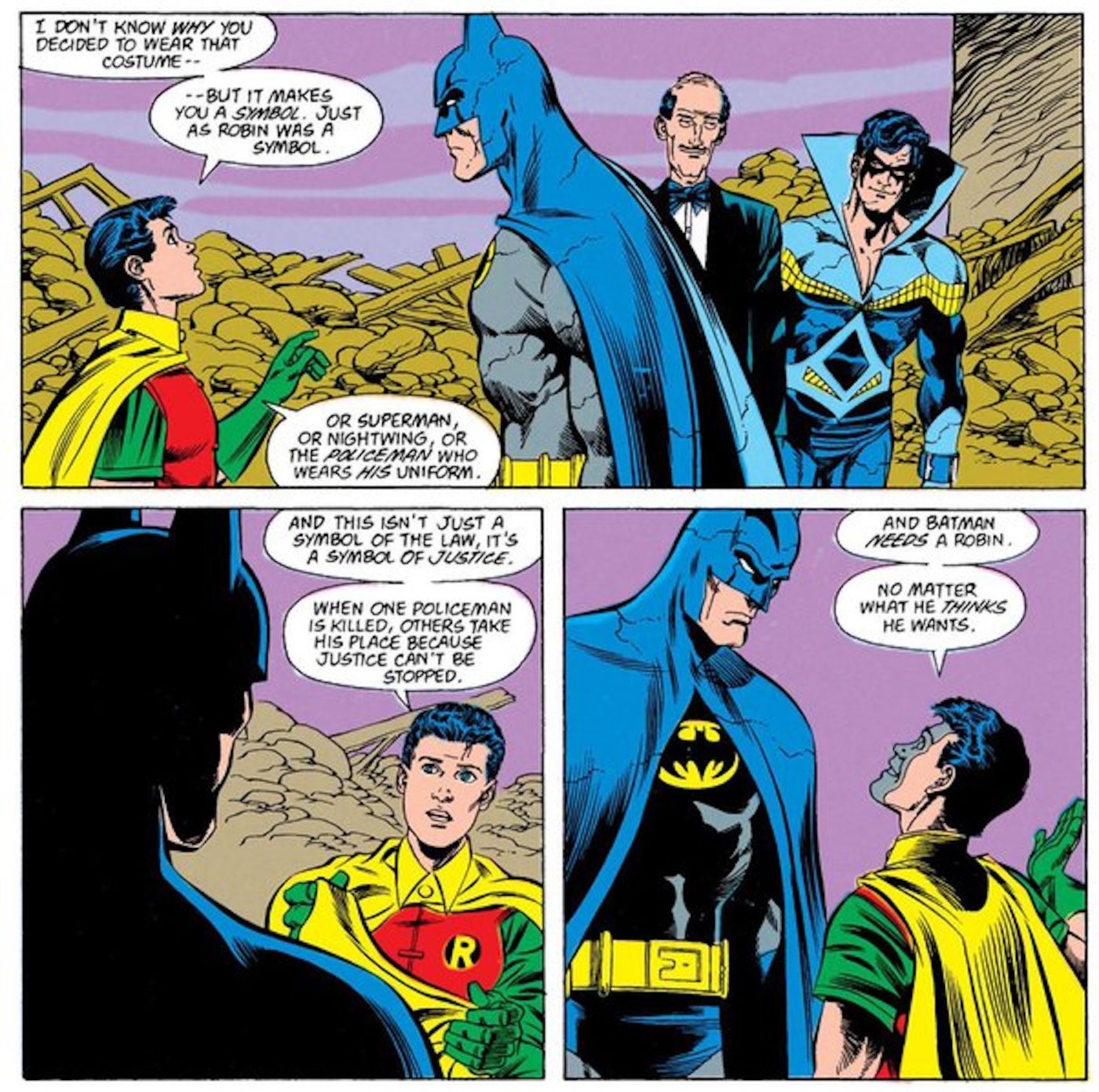  Tim Drake as Robin talks to Batman as Nightwing and Alfred watch.