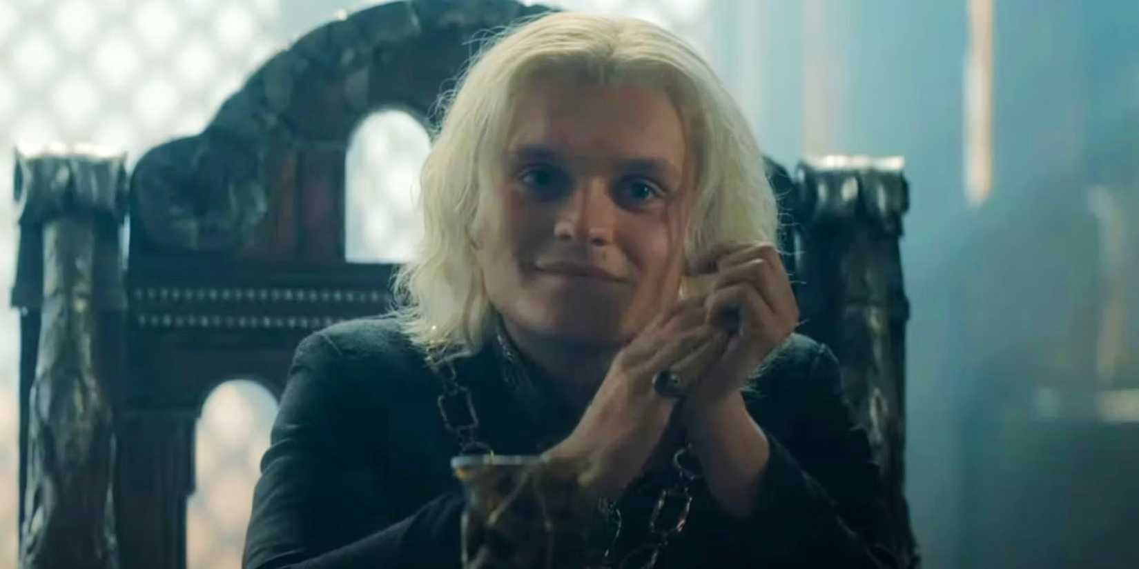 King Aegon II rubbing his hands together in House of the Dragon season 2