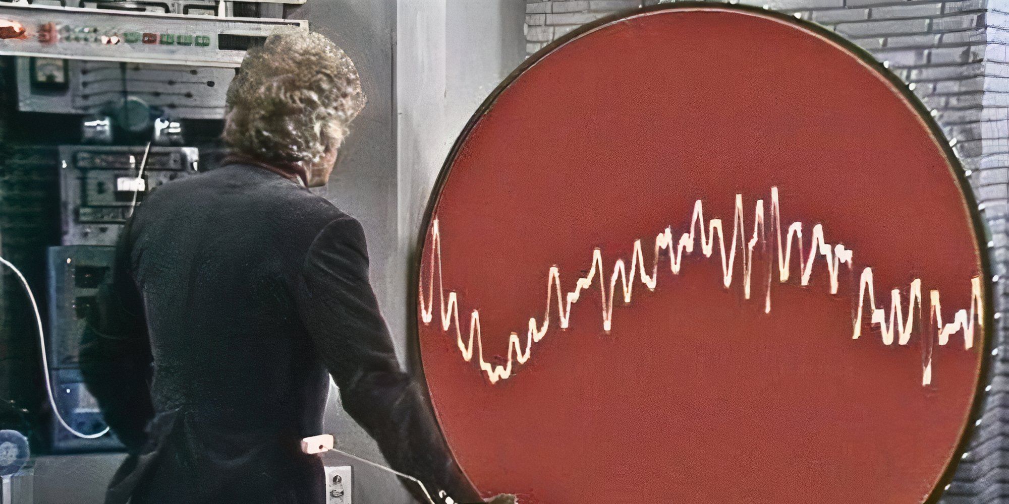 Jon Pertwee's Third Doctor looking at the BOSS computer in Doctor Who