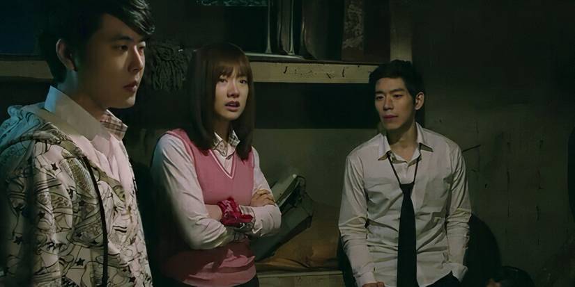A group of students hide together and discuss their options in the Korean movie Zombie School
