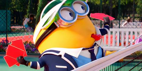 A Minion Holding Out Multiple Red Cards Behind a Tennis Net in Despicable Me 4