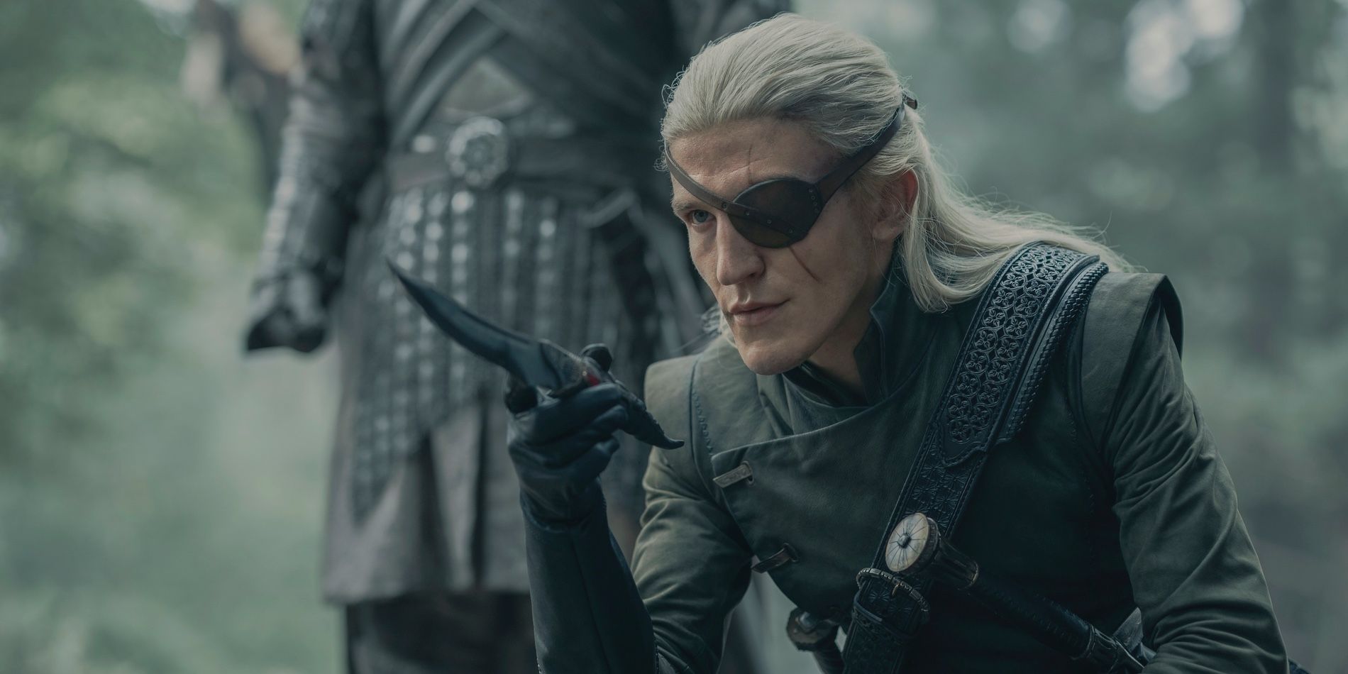 Aemond Targaryen (Ewan Mitchell) points the Valyrian steel dagger forward with Criston Cole behind him in House of the Dragon season 2, episode 4