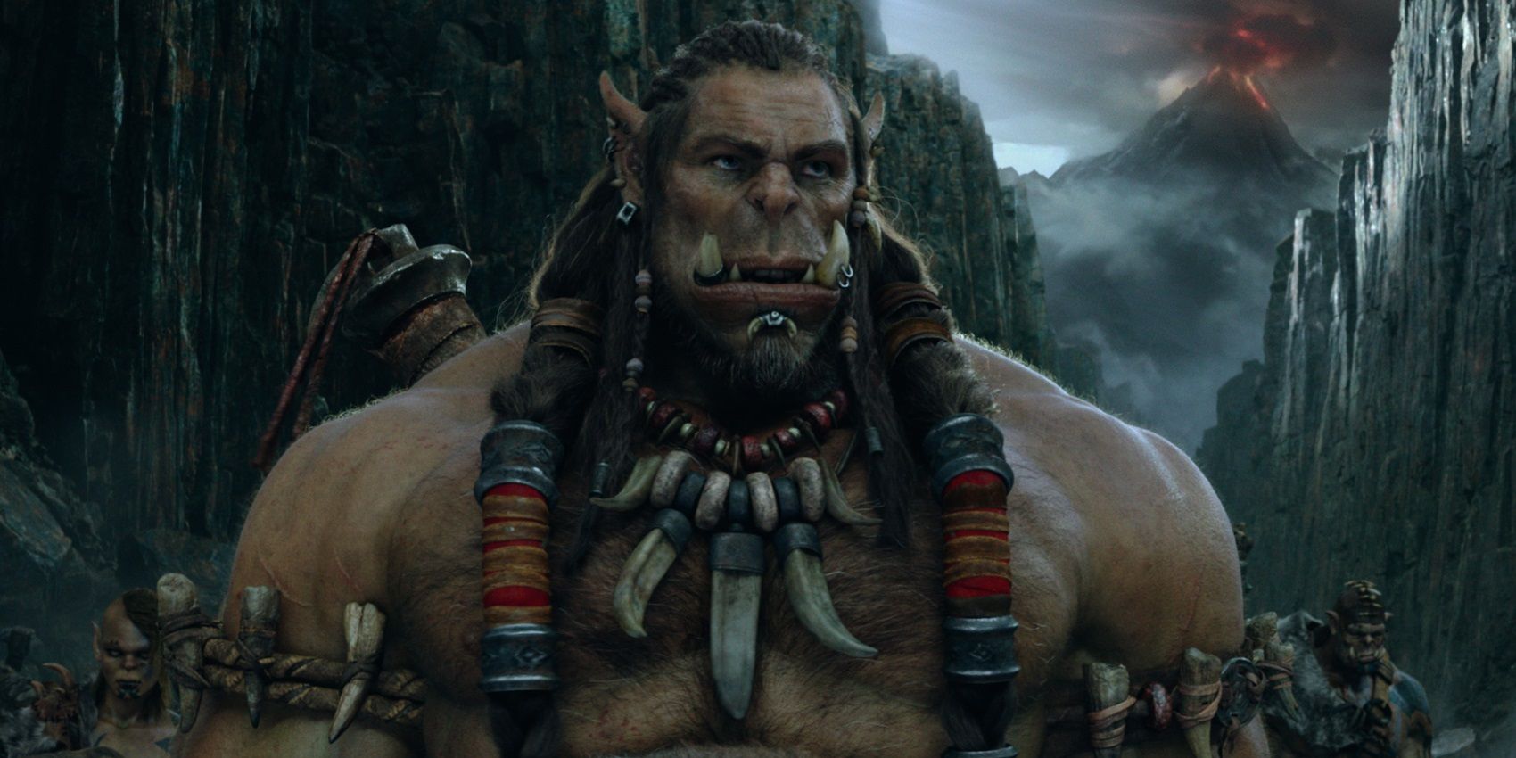 An Orc standing with his troops in the Warcraft movie