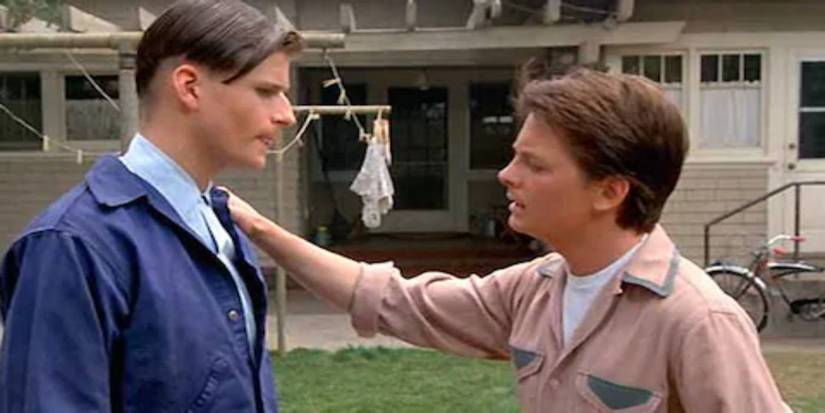 Back to the Future George and Marty McFly standing with Marty's hand on George's shoulder