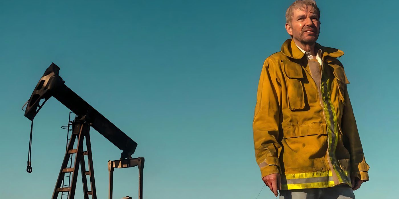 Billy Bob Thorton stands near an oil rig looking distraught in Landman