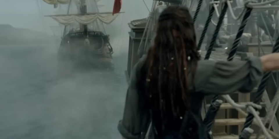 Anne Bonny hangging at the side of her ship while Captain Teach Vs Commodore Chamberlain fight in Black Sails