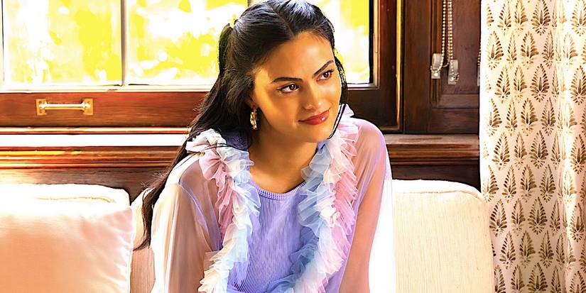 Camila Mendes' Drea sits and smiles in Do Revenge