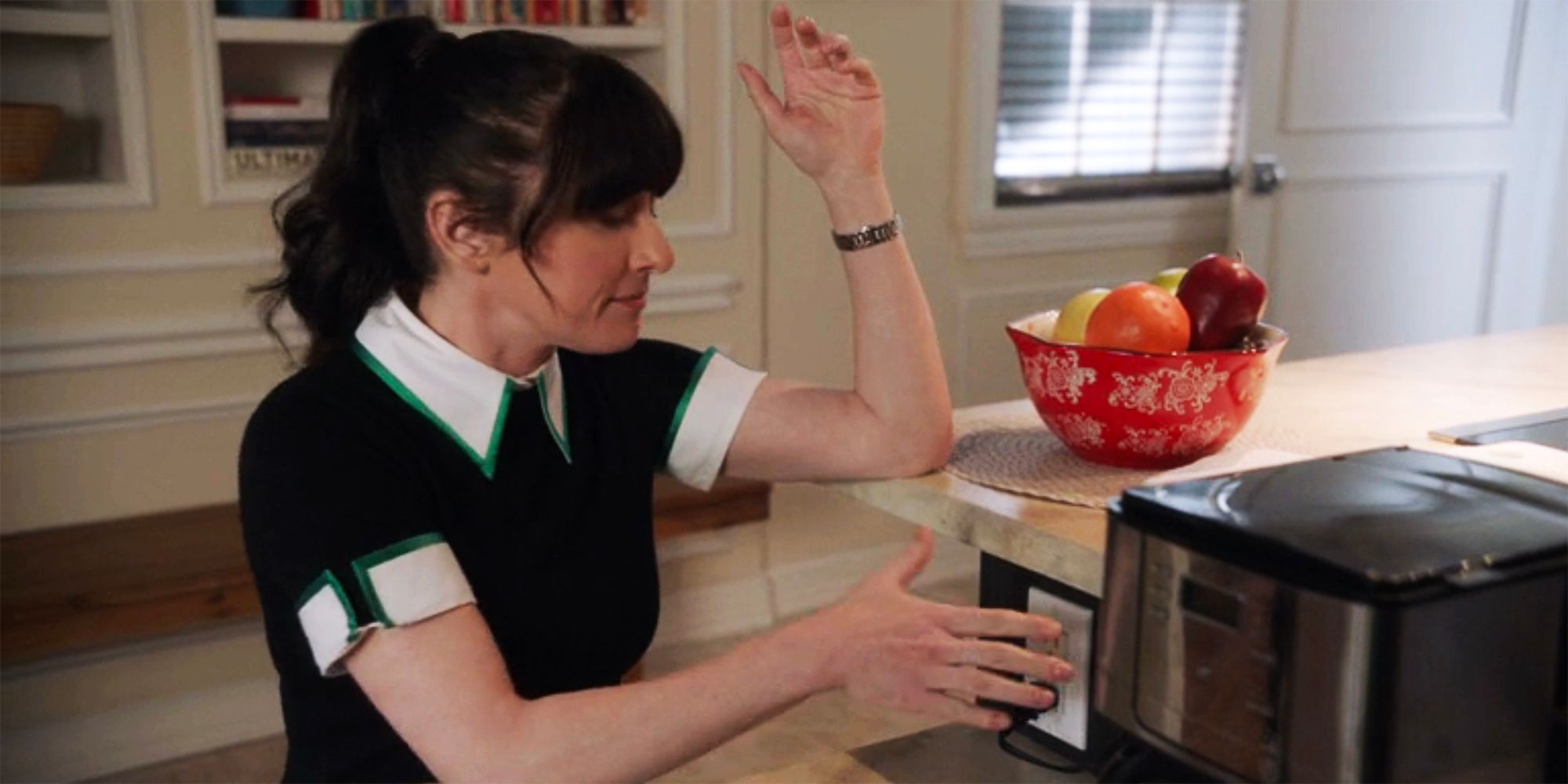 Delilah McGee engaging with the electrical outlet theatrically in NCIS