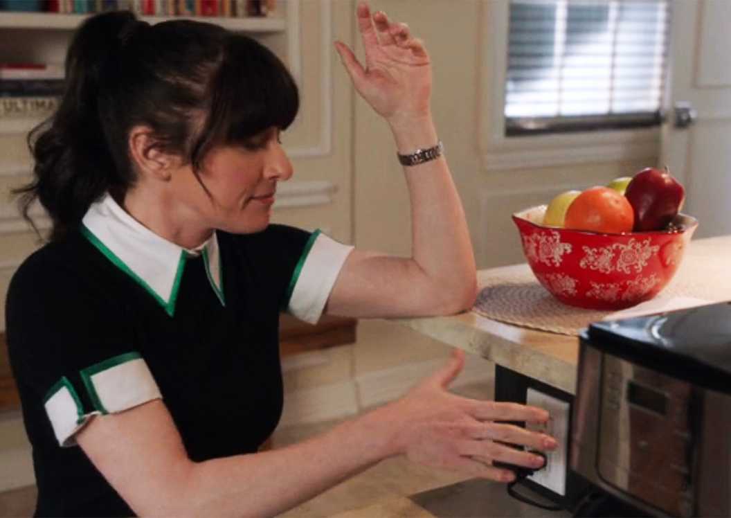 Delilah McGee engaging with the electrical outlet theatrically in NCIS