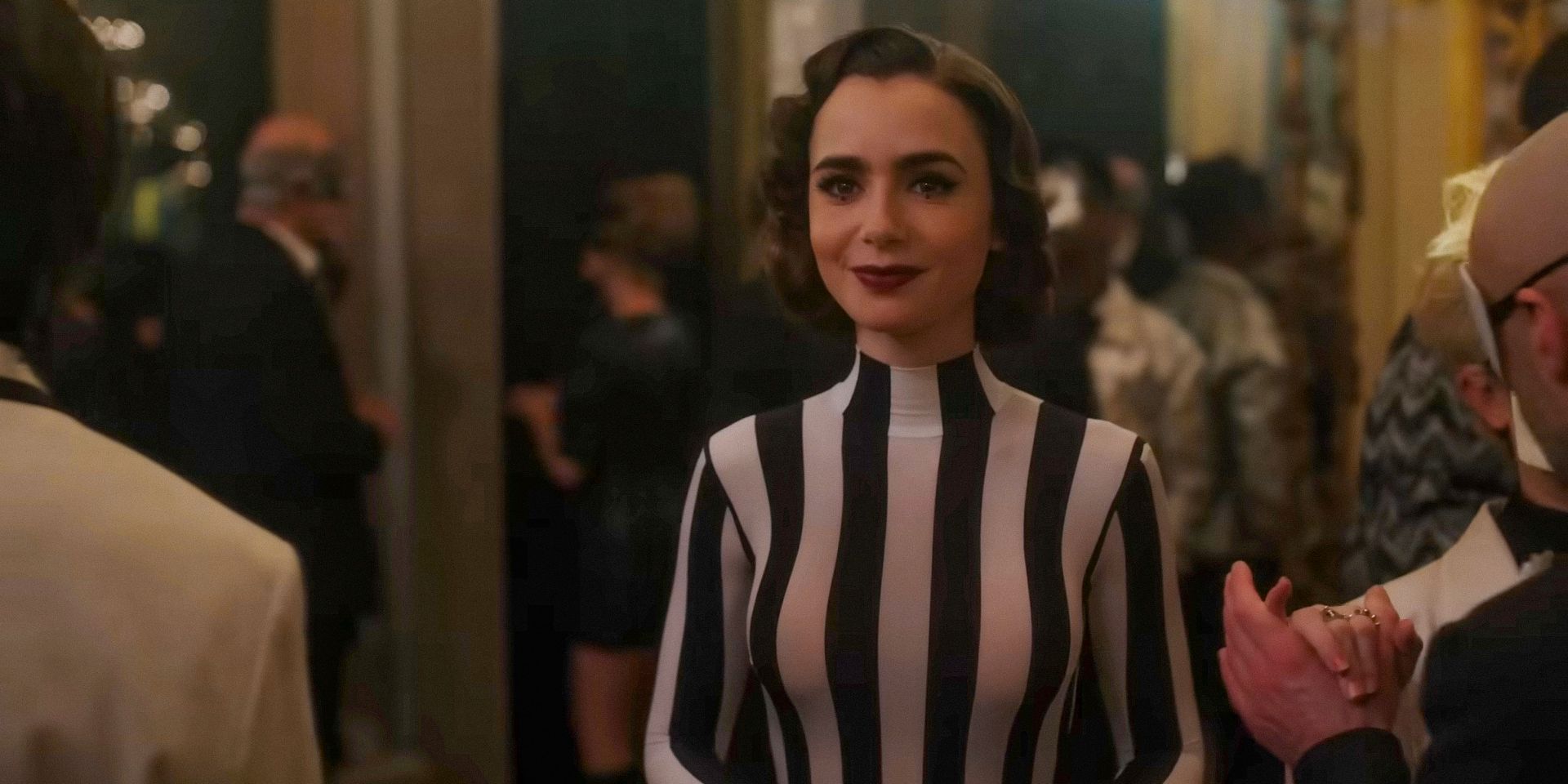 Emily (Lily Collins) in a striped outfit at a party in Emily in Paris season 4