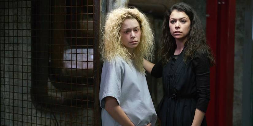 Helena and Sarah (Tatiana Maslany) standing side by side in Orphan Black Series Finale