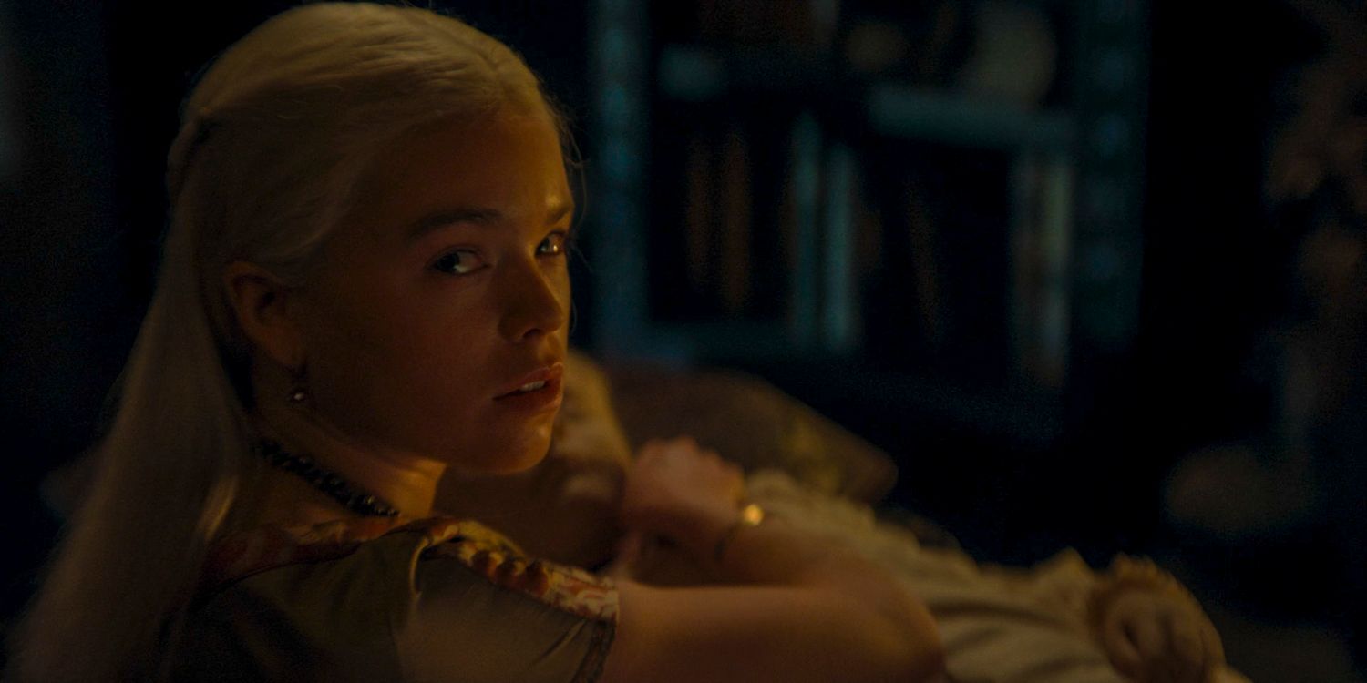 Young Rhaenyra Targaryen (Milly Alcock) holding in her arms the deceased baby Jaehaerys in House of the Dragon season 2 episode 3