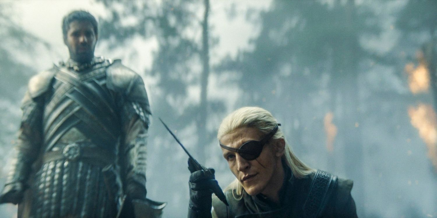 Aemond Targaryen (Ewan Mitchell) holding Aegon's dagger while Ser Criston Cole (Fabien Frankel) watches in House of the Dragon season 2 episode 4