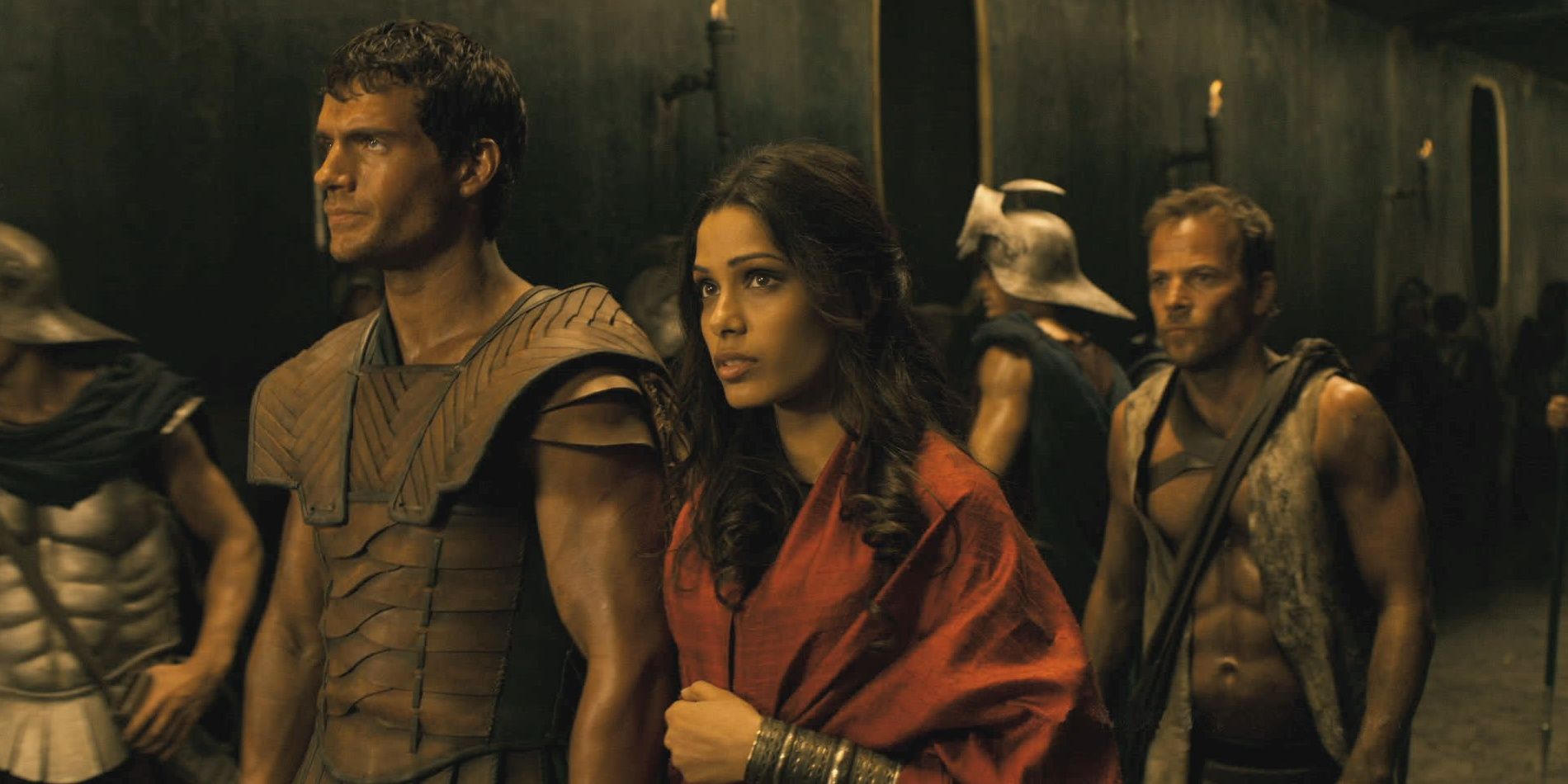 Phaedra (Freida Pinto) in Immortals dressed in red and walking in Immortals