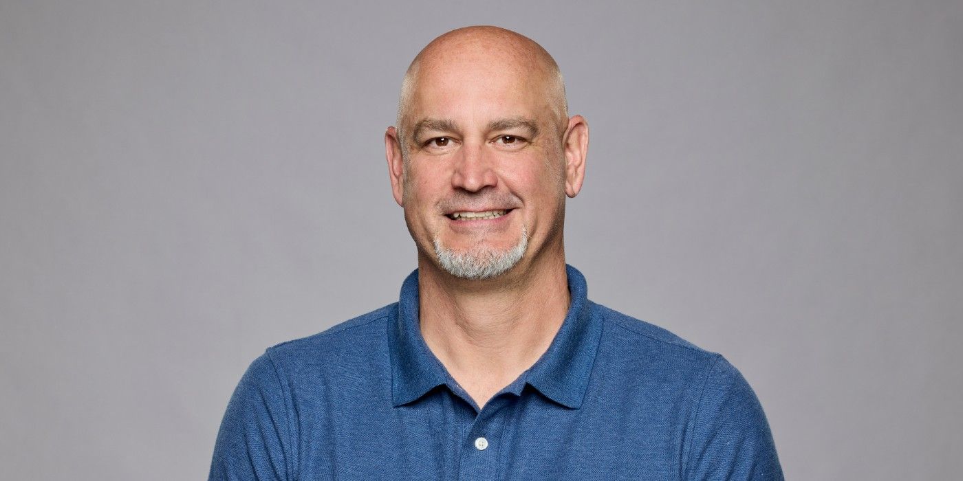Kenney Kelley from Big Brother 26 posing in front of a gray background.