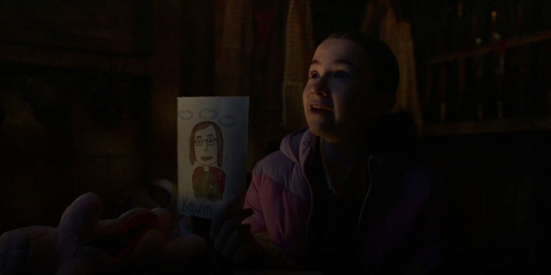 Saffron Holding Up A Drawing Of Kevin In Time Bandits 2024.jpg