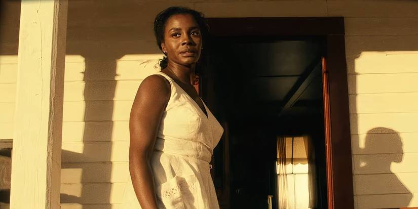 Lucky Emory (Deborah Ayorinde) standing on her front porch in Them Covenant
