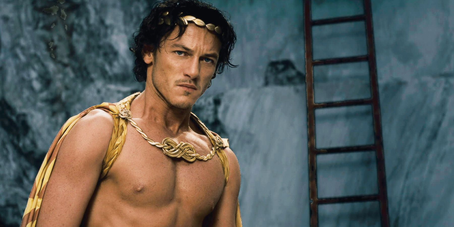 Luke Evans as Zeus, shirtless and looking stoic, in Immortals 