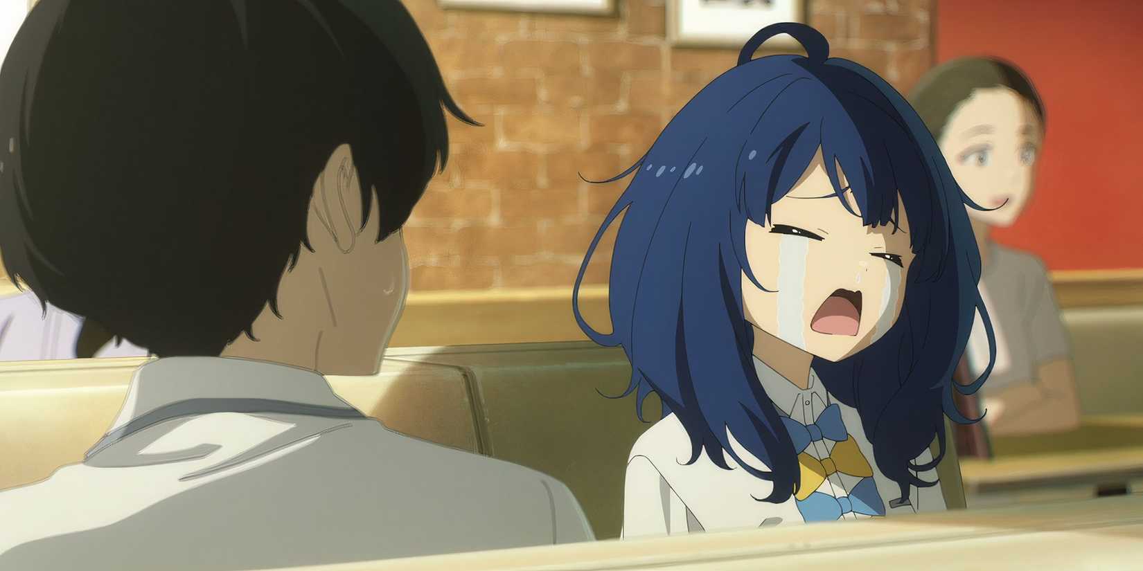 Anna cries aloud while Kazuhiko looks on as the two set in a booth in a family restaurant