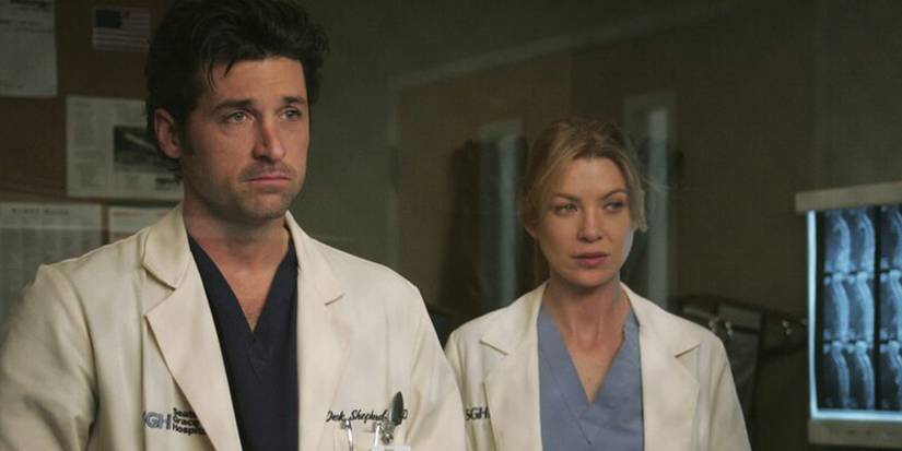 meredith and derek standing in the hospital in grey's anatomy