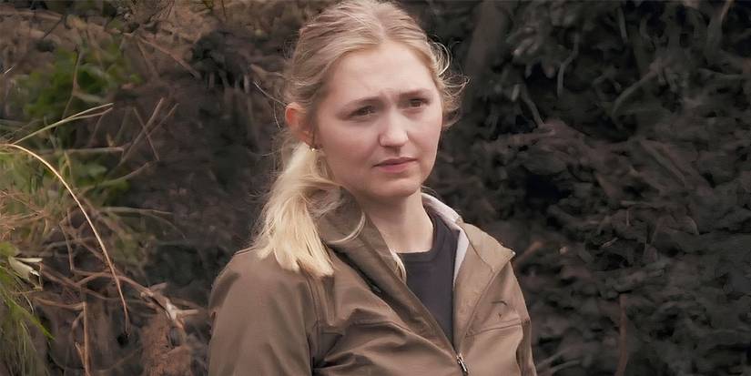 Miriam Amirault looking at something in The Curse of Oak Island.