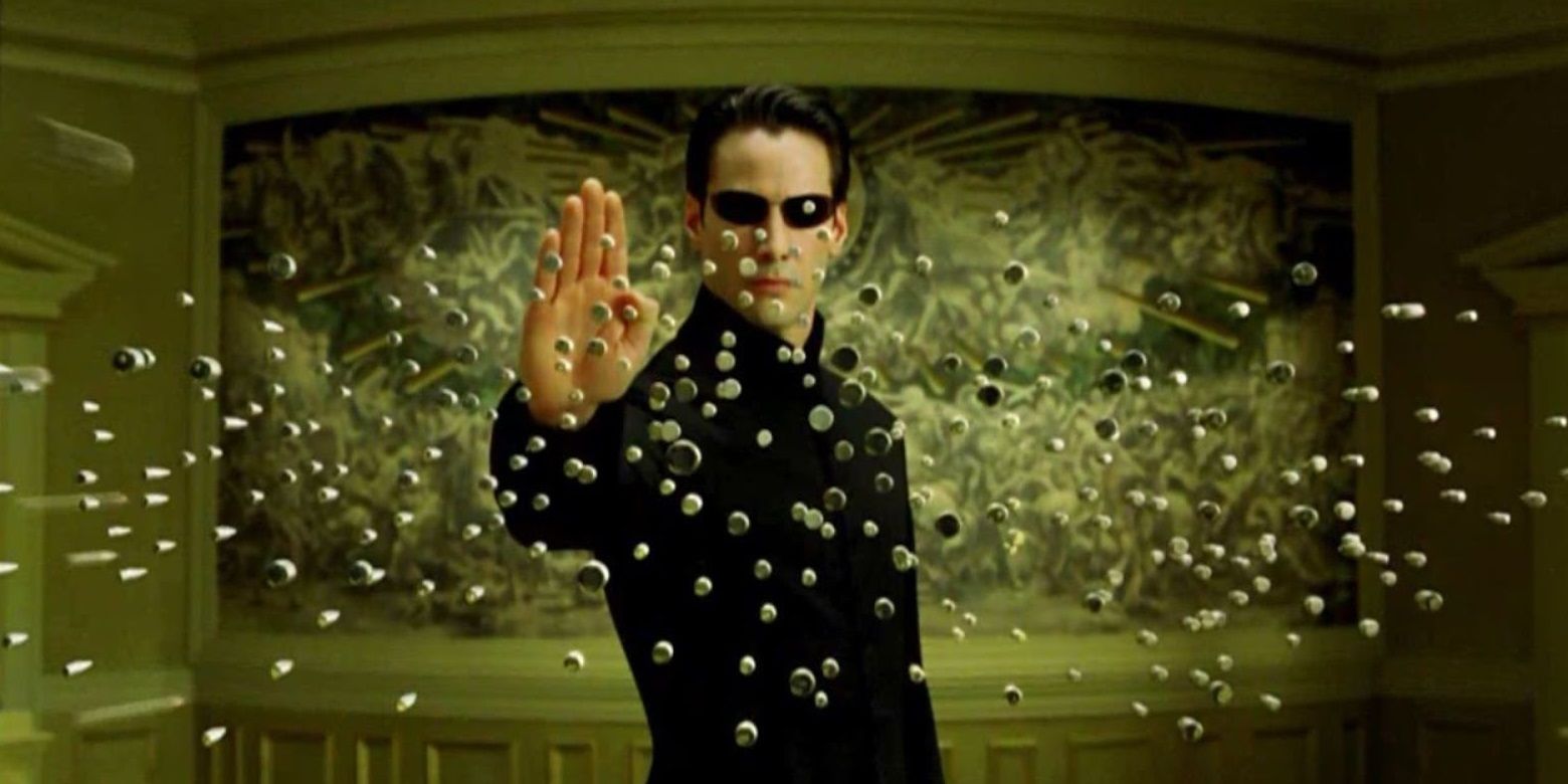 Neo (Keanu Reeves) stops bullets in The Matrix Reloaded