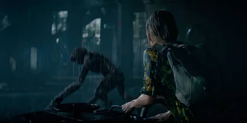 Emily Blunt watches the death angel in the rain in a quiet place 2