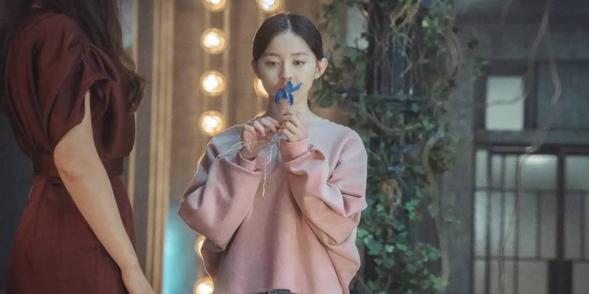 Park Ji-hu playing Oh In-hye in Little Women 2022 Kdrama, smelling a blue orchid