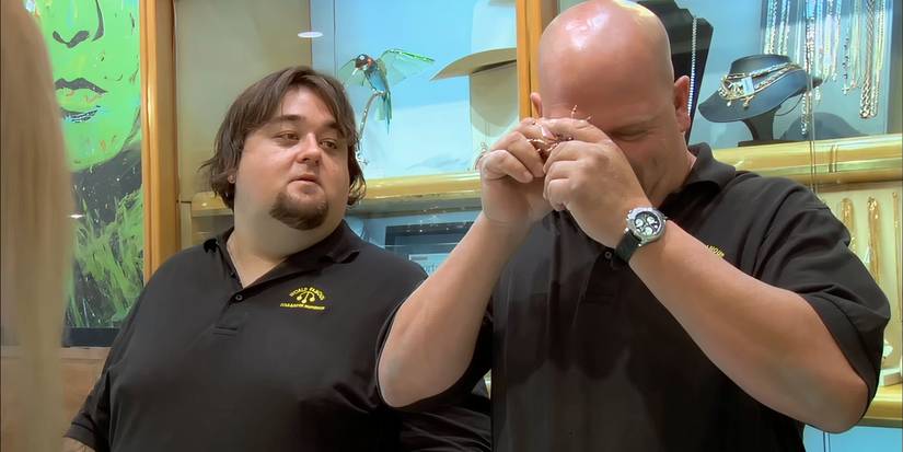 Rick looking at the Faberge spider brooch as Chumlee watches on Pawn Stars.