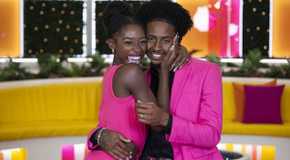 Serena Page & Kordell Beckham from Love Island USA Season 6 posing in matching pink outfits in front of a yellow couch.