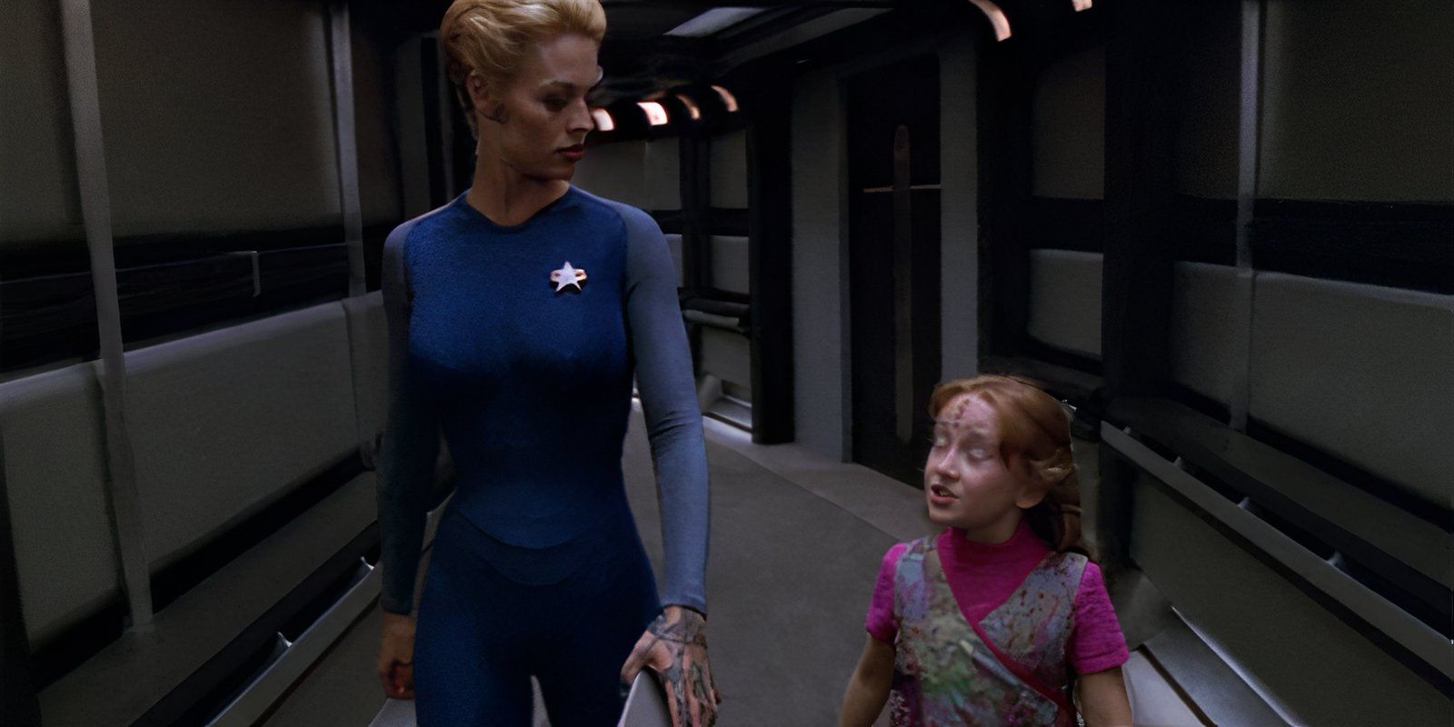 Seven of Nine (Jeri Ryan) and Naomi Wildman (Scarlett Pomers) walk down the hallway Star Trek Voyager-1