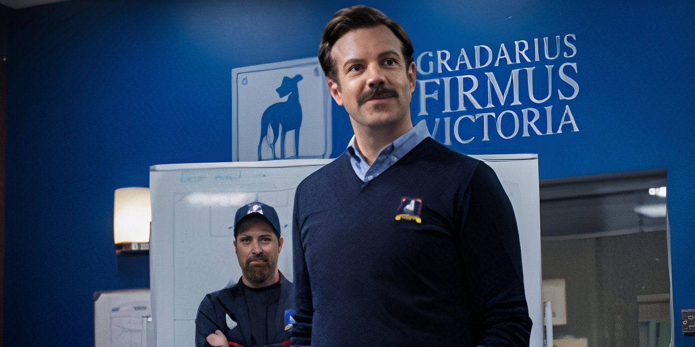 Ted Lasso (Jason Sudeikis) smiling in the lockerroom with Gradarius Firmus Victoria on the wall behind him.