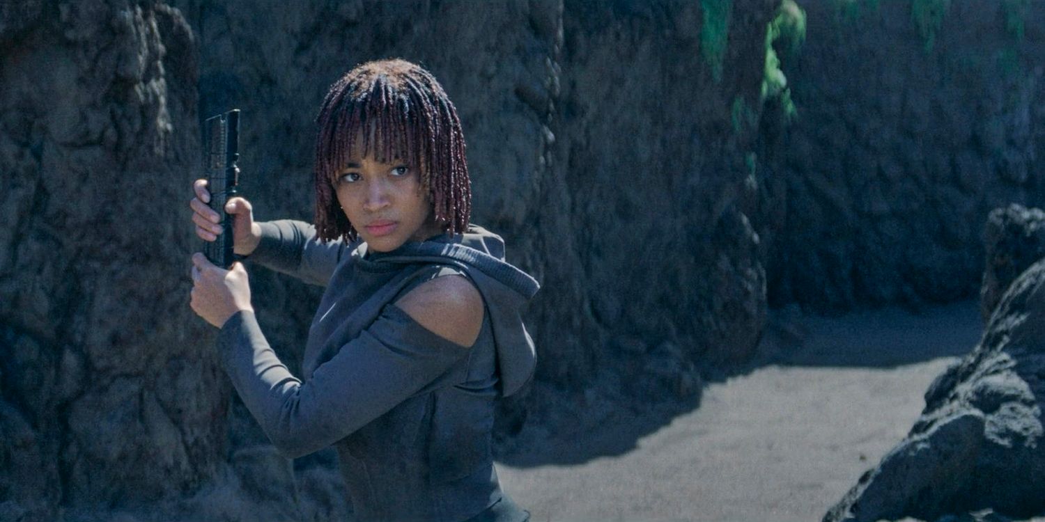 Osha (Amandla Stenberg) wielding the hilt of Qimir's lightsaber in The Acolyte season 1 episode 6