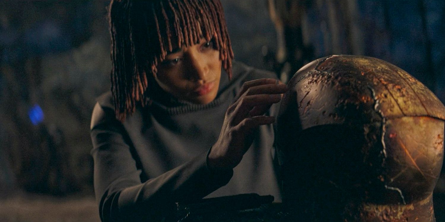 Osha (Amandla Stenberg) touching Qimir's helmet with curiosity in The Acolyte season 1 episode 6