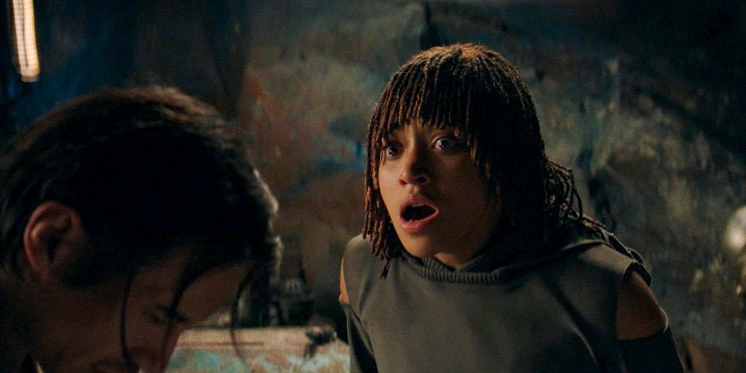 Osha (Amandla Stenberg) shocked and with her eyes glowing red after using Qimir's helmet in The Acolyte season 1 episode 8