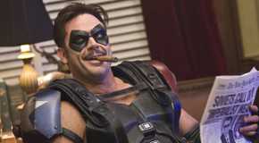 Jeffrey Dean Morgan smoking a cigar as Edward Blake aka The Comedian in Watchmen