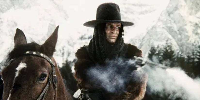  Klaus Kinski firing a gun from a horse in the cold in The Great Silence (1968)