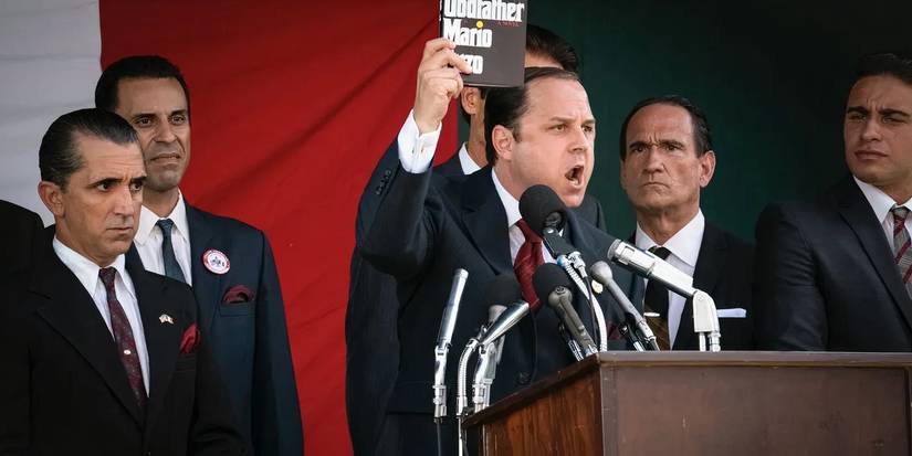 Joe Colombo (Giovanni Ribisi) holding up a copy of The Godfather in The Offer.