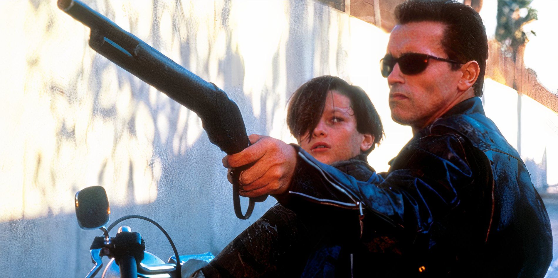 The terminator on the back of a motorcycle with John in Terminator 2