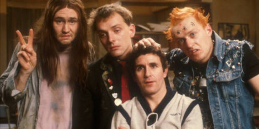 Adrian Edmondson, Rik Mayall, Nigel Planer, and Christopher Ryan in The Young Ones (1982)