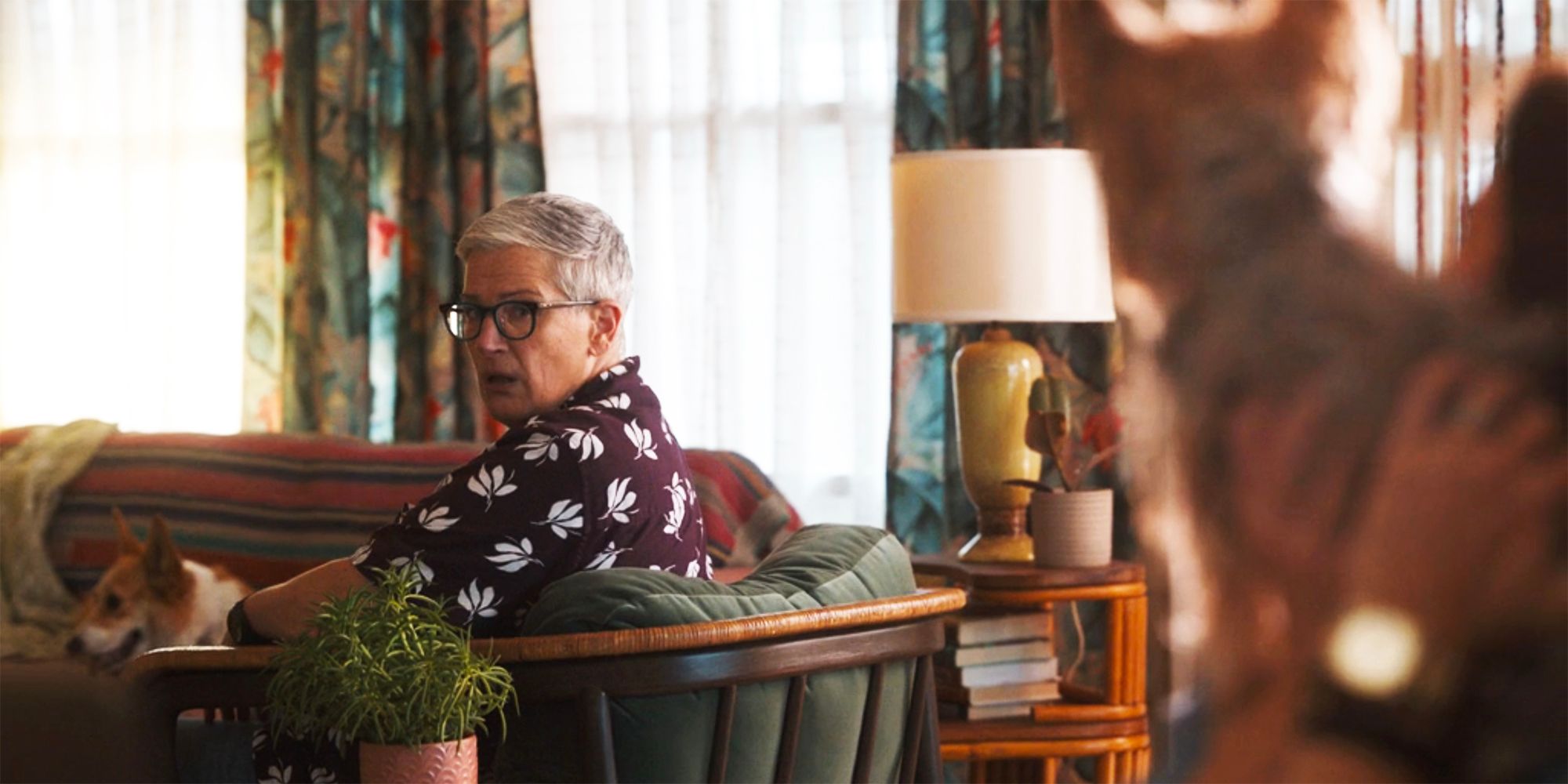 Velma looking over her shoulder at something off screen in Tracker