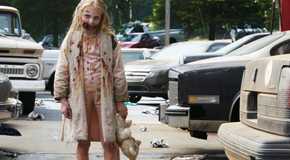 Zombie girl holding a teddy bear in The Walking Dead episode 1.