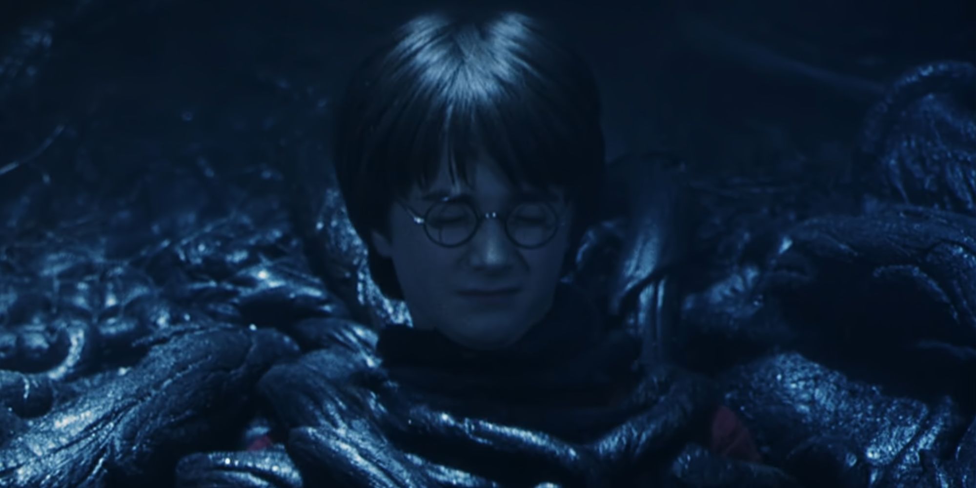 Daniel Radcliffe as Harry Potter trapped by Devil's Snare in The Sorcerer's Stone