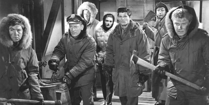 The Thing From Another World (1951) The entire cast looking scared and unsure all wearing winter clothing 