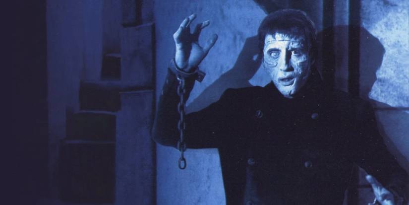 Christopher Lee as Frankenstein's Monster with a chain attached to his wrist in The Curse of Frankenstein