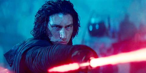 Adam Driver pointing a lightsaber as Kylo Ren in Star Wars The Rise of Skywalker